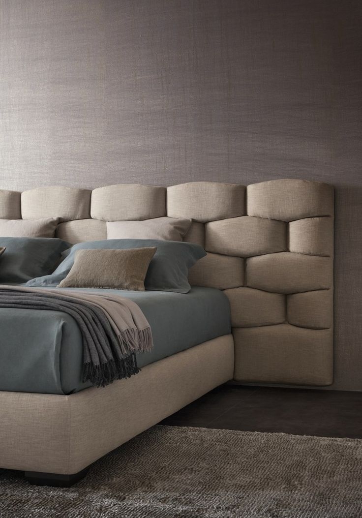 The most unique upholstered bed I've ever seen. This takes a spin of finesse by showcasing a brick-like layout but instead of rough stone, you have something that is more soft to the touch.