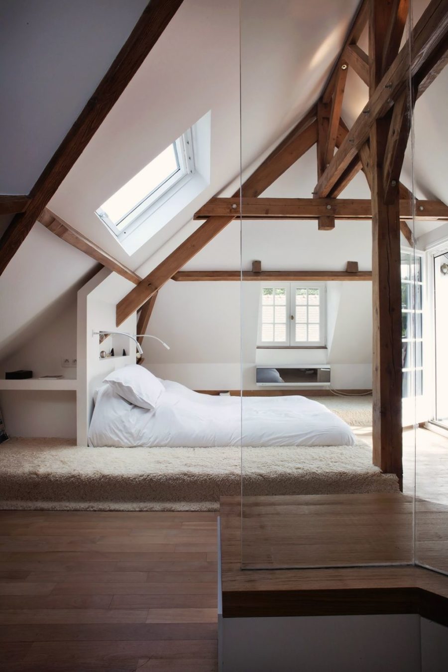 What a cool idea for an attic space. Stained wood beams are a grand measure that really helps get that wow-effect.