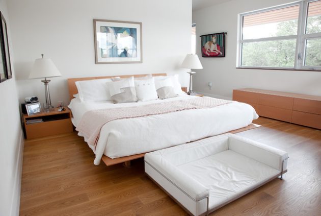 Wood floors help your bedroom take on that natural ambiance. Choosing lighter colors to accent the wood make your bedroom feel larger.