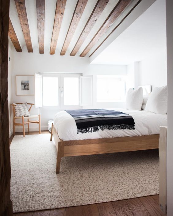 Country style bedrooms are a great way to spice up your home. This features distressed boards that line the ceiling, and a distressed furniture to go with it. Best part is, the more you beat up your furniture, the better it looks.