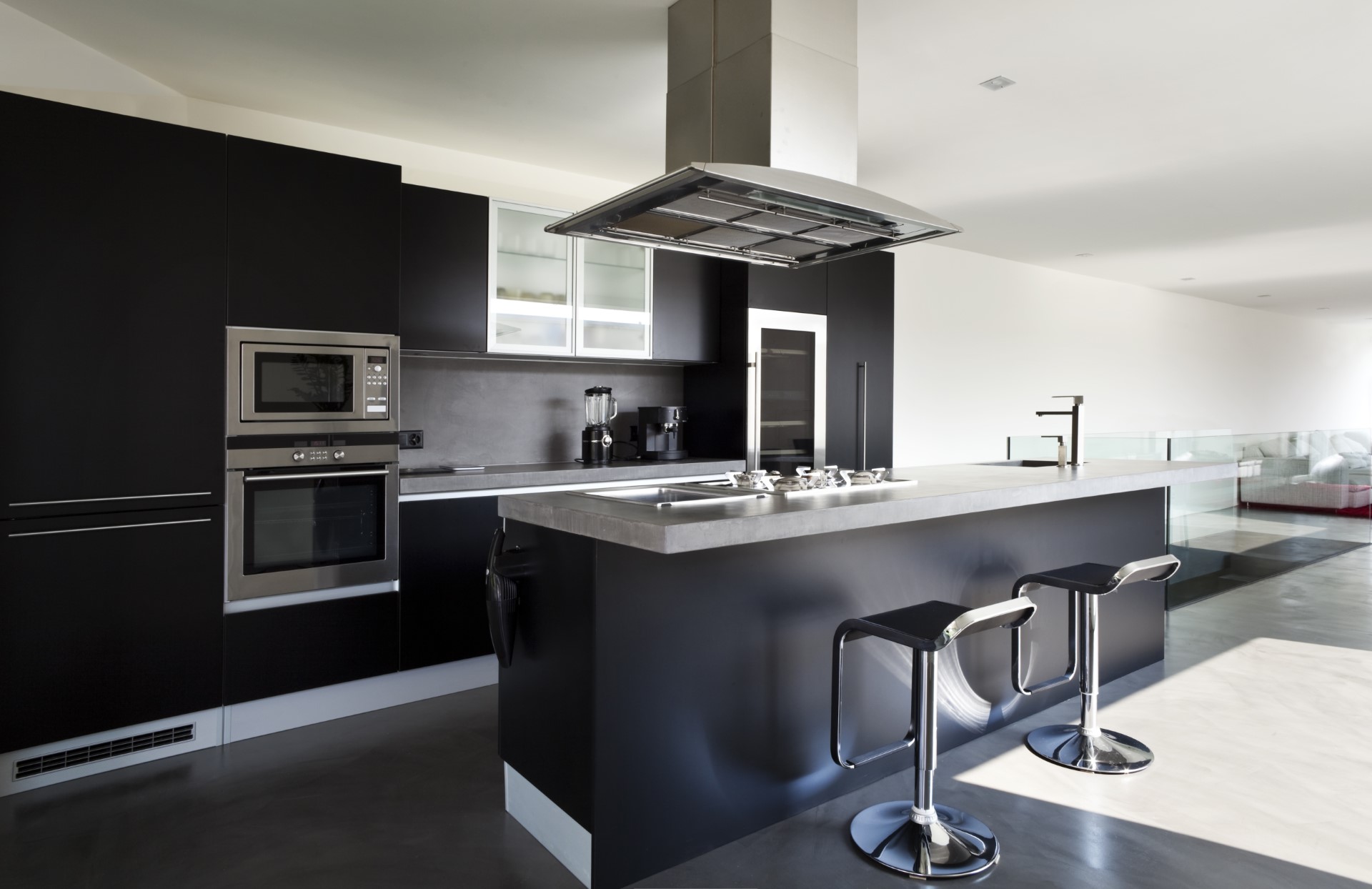 Dark cabinets carry the functionality of being low maintenance and seemingly always looking good. They're great at hiding finger prints and when you add in stainless steel, it makes it shine.