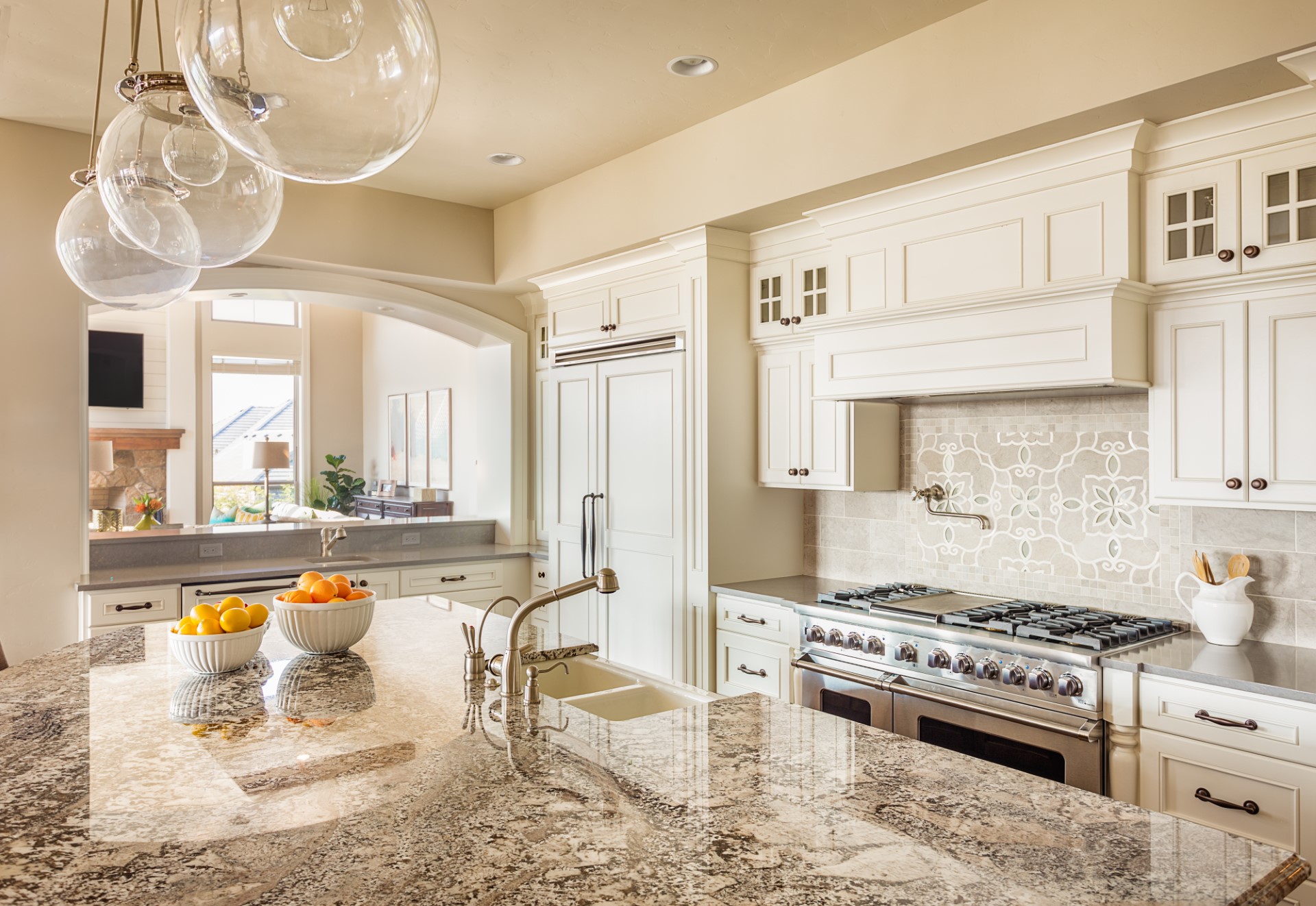 This is a beautiful kitchen design with a granite slab that is sure to amaze. A kitchen like this gives off a Cape Cod type of ambiance, and the best part is it has two sinks so your kids can do dishes with you.