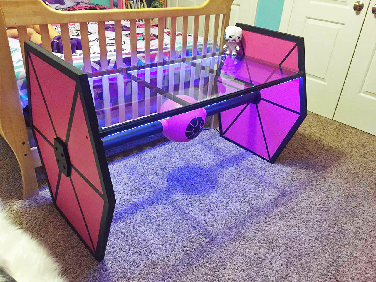 Not something you see every day, this pink tie fighter glass table is one-of-a-kind.