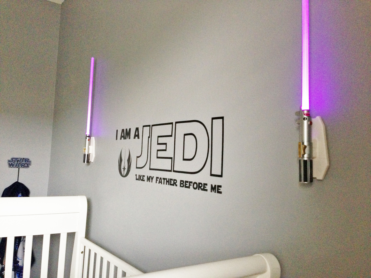 These pink Jedi light sabers are one-of-a-kind for this crib room.