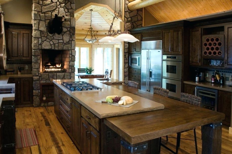 When you're bring the family together, there's no better way to do it than bringing in a fire pit to this countryside farmhouse design. It even features an area to store all your wine bottles, an island counter stop with tons of seating to eliminate the need for a table, and lighting over the built-in gas stove. This is truly a dream rustic kitchen idea.