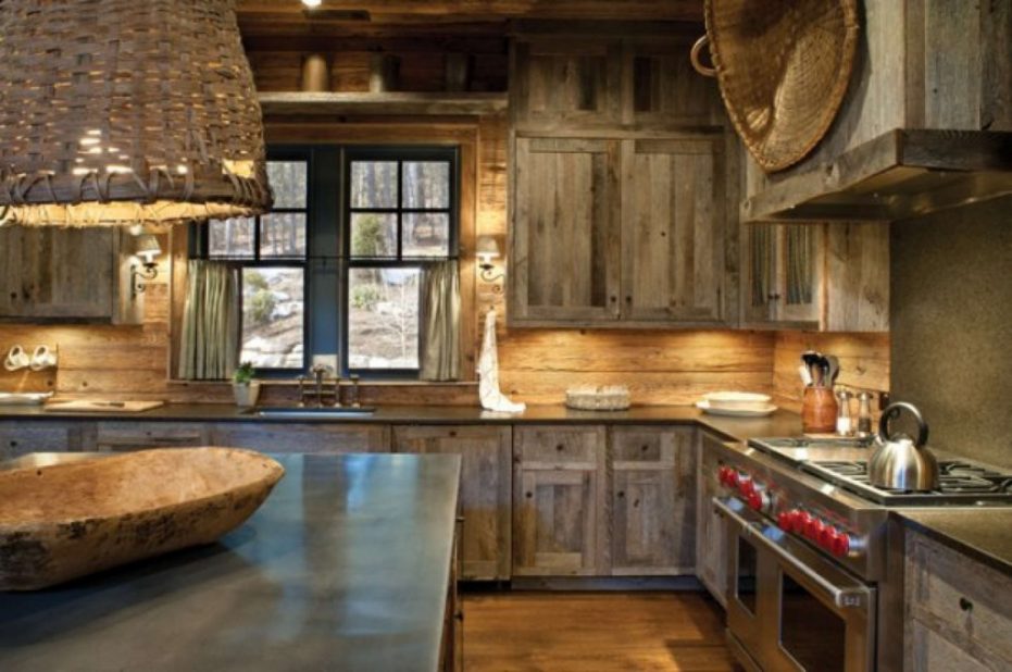 This rustic farmhouse style kitchen features worn and weathered dark stain cabinets that provides a very natural feel. It's a great idea if you're looking for a warm comforting kitchen.