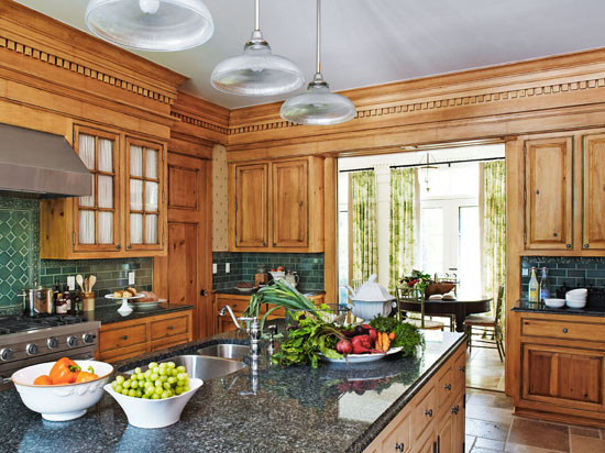 A little bit more an elegant design, this dream farmhouse kitchen features granite countertops for extended durability.