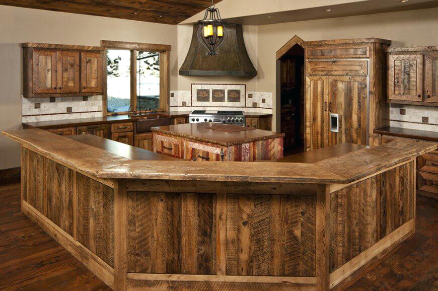 A farmhouse kitchen with dark countertops and wood flooring is a great idea to add warmth to your kitchen.