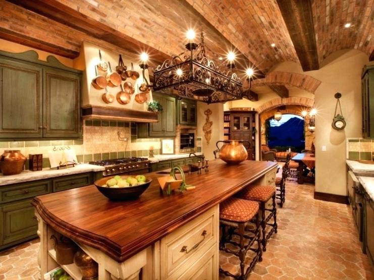 A country farmhouse kitchen this country farmhouse kitchen features brick ceiling with a wood countertop slab with seeding and lighting overhead to provide warmth and durability.