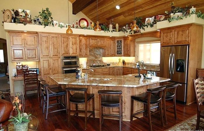 Remodeling your kitchen with a rustic farmhouse design can provide you a warm feel especially if you add an island with adequate ceiling and good lighting.